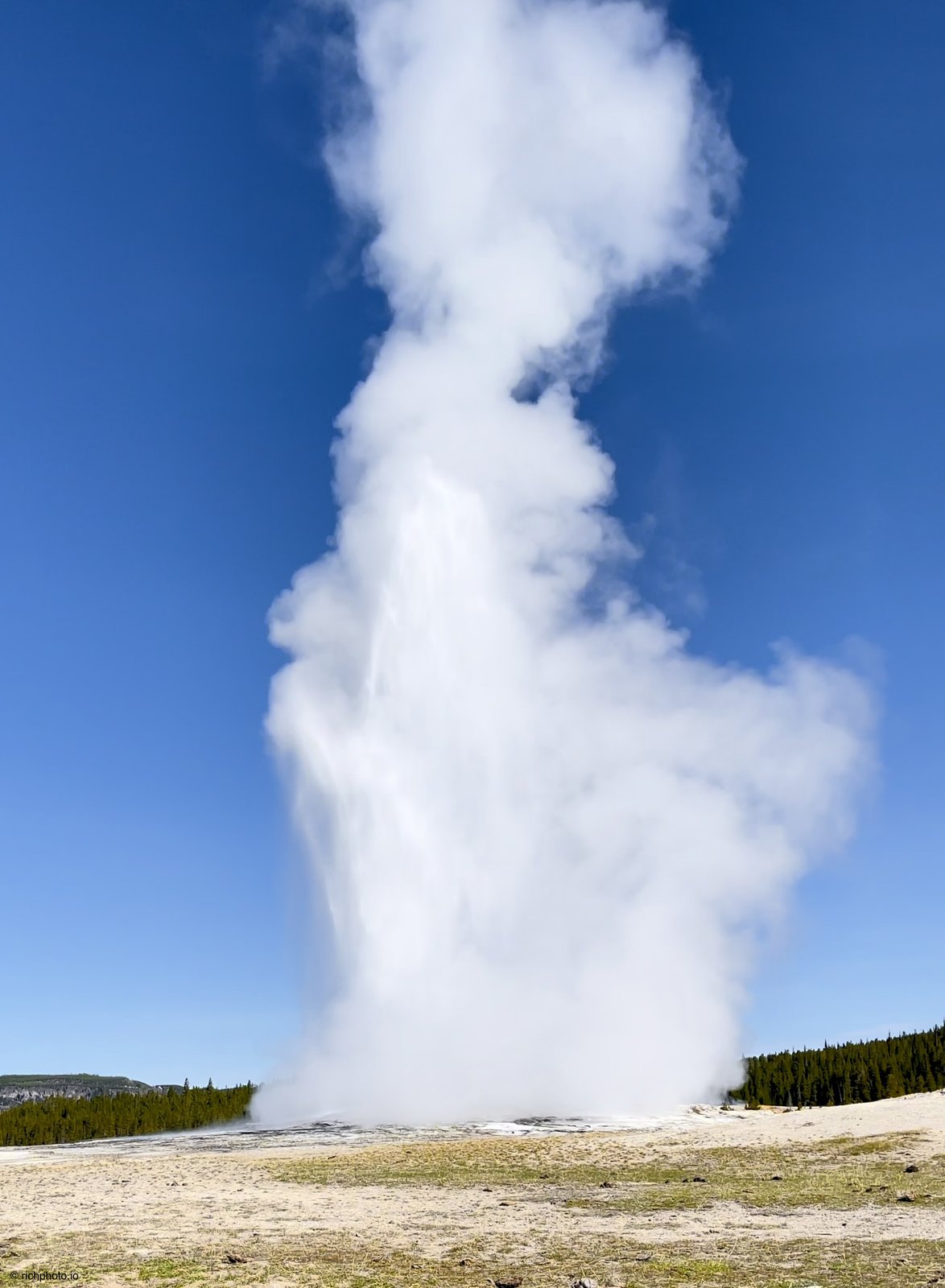 Old Faithful erupting in the Upper Geyser Basin, Yellowstone